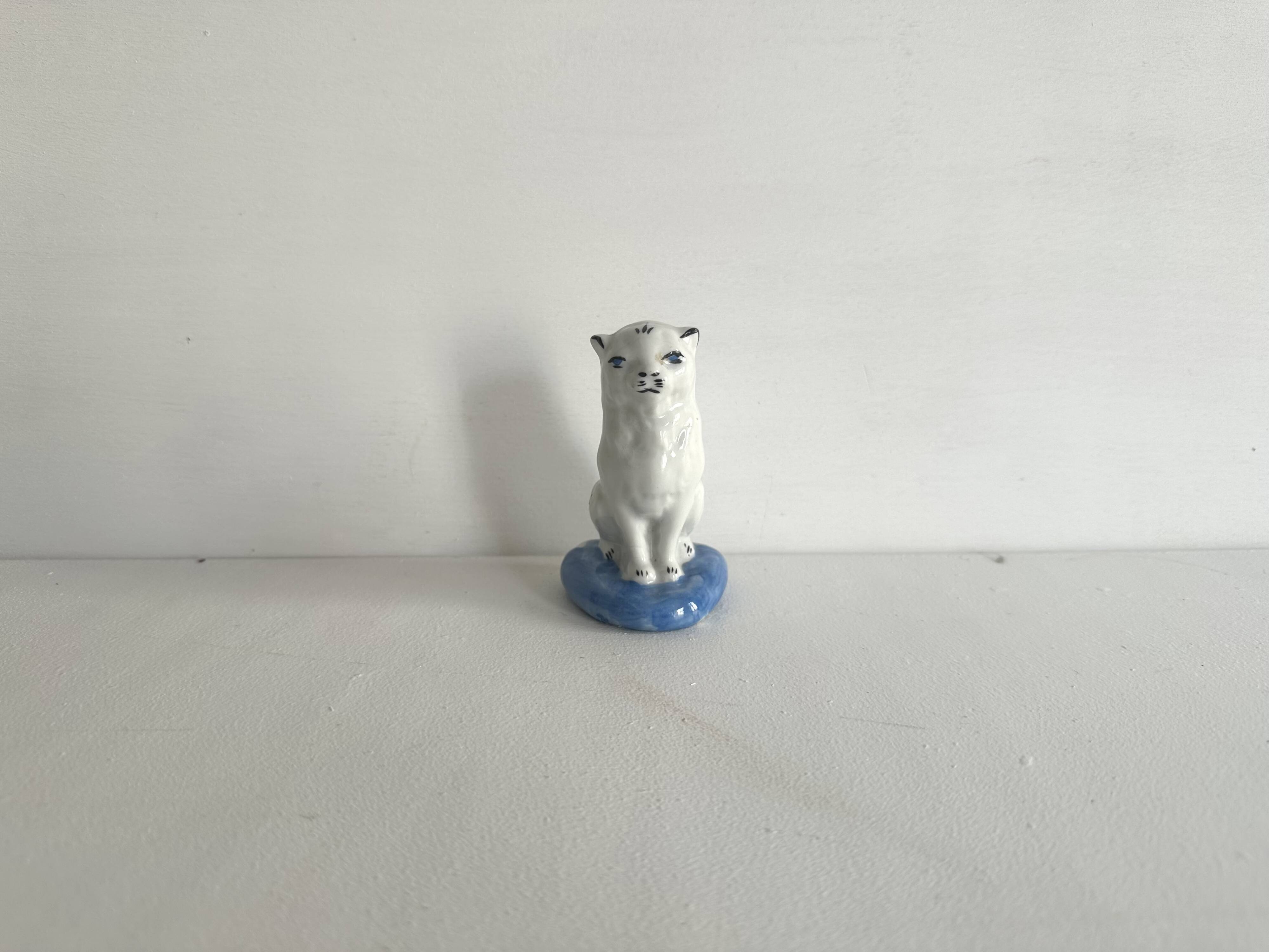 Small ancient glazed ceramic cat from the 19th century.