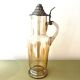 Vintage glass and tin jug