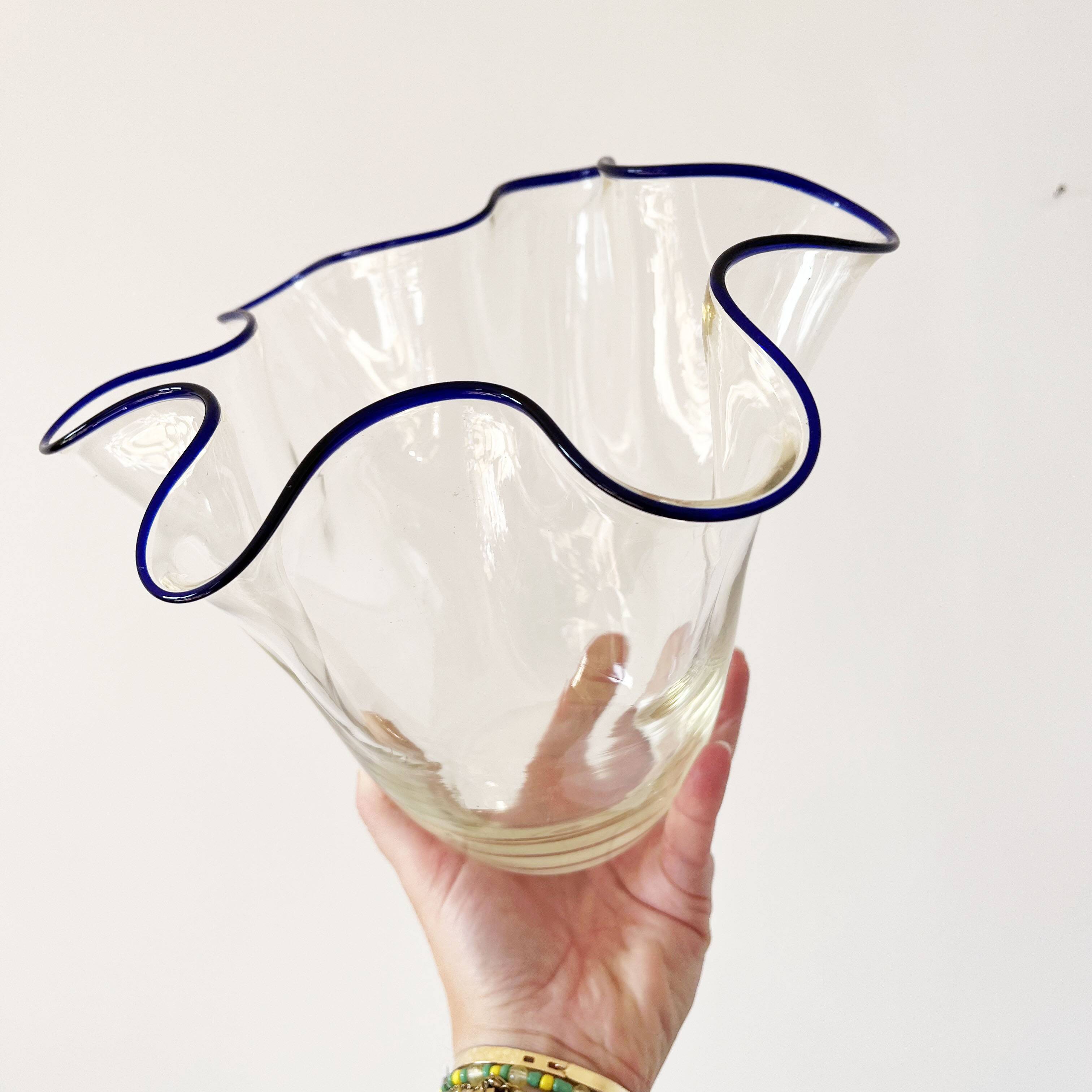 Blue-edged blown glass handkerchief vase