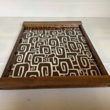 Old wooden tray with psychedelic art deco patterns