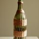 Glass bottle covered with wicker, France of the 60