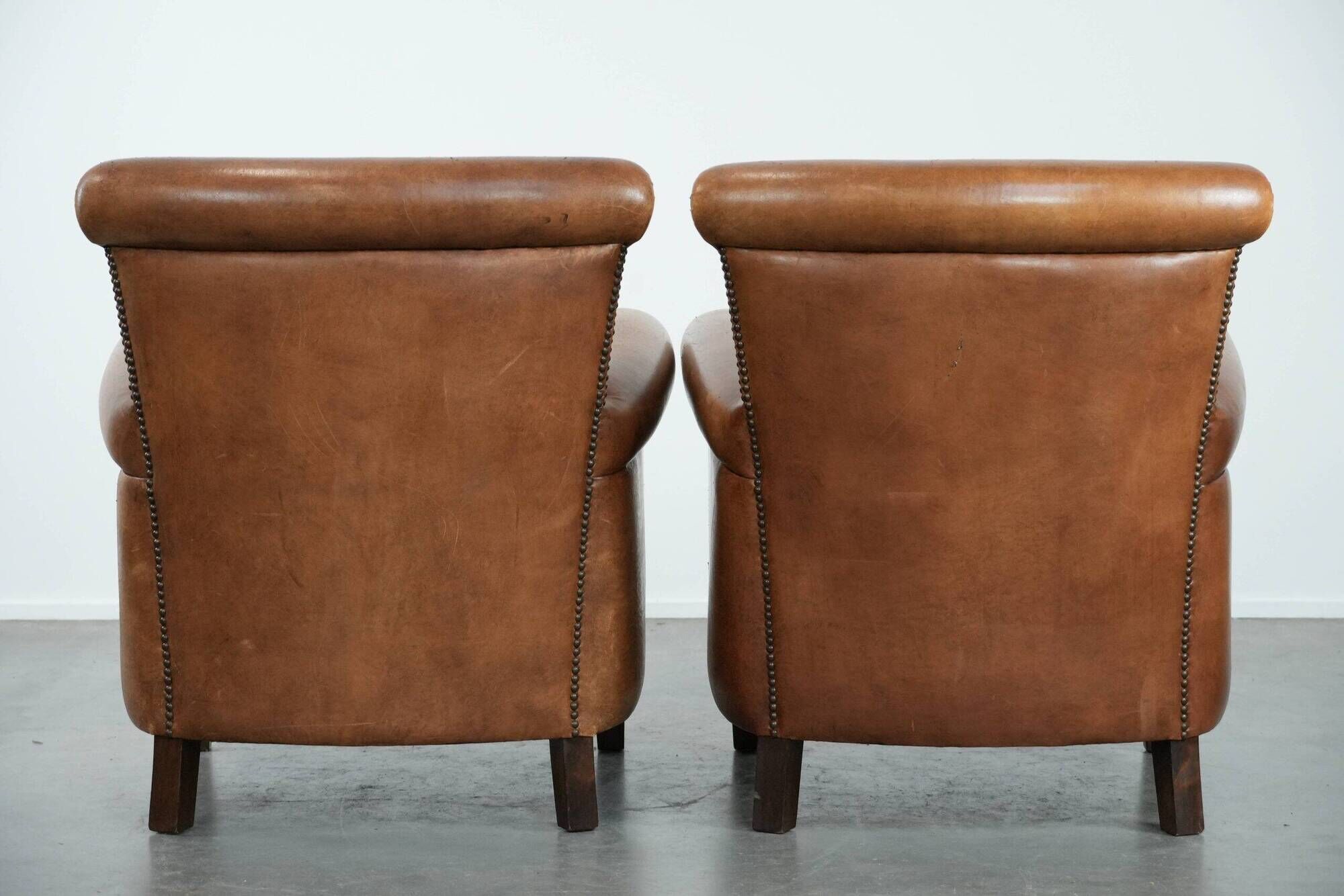 Set of two vintage sheepskin armchairs with beautiful and warm colours