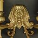 Pair of wall sconces with grotesque heads in 19th-century Renaissance style - bronze