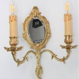 Pair of Louis XV style beveled mirror sconces in bronze by Lucien Gau