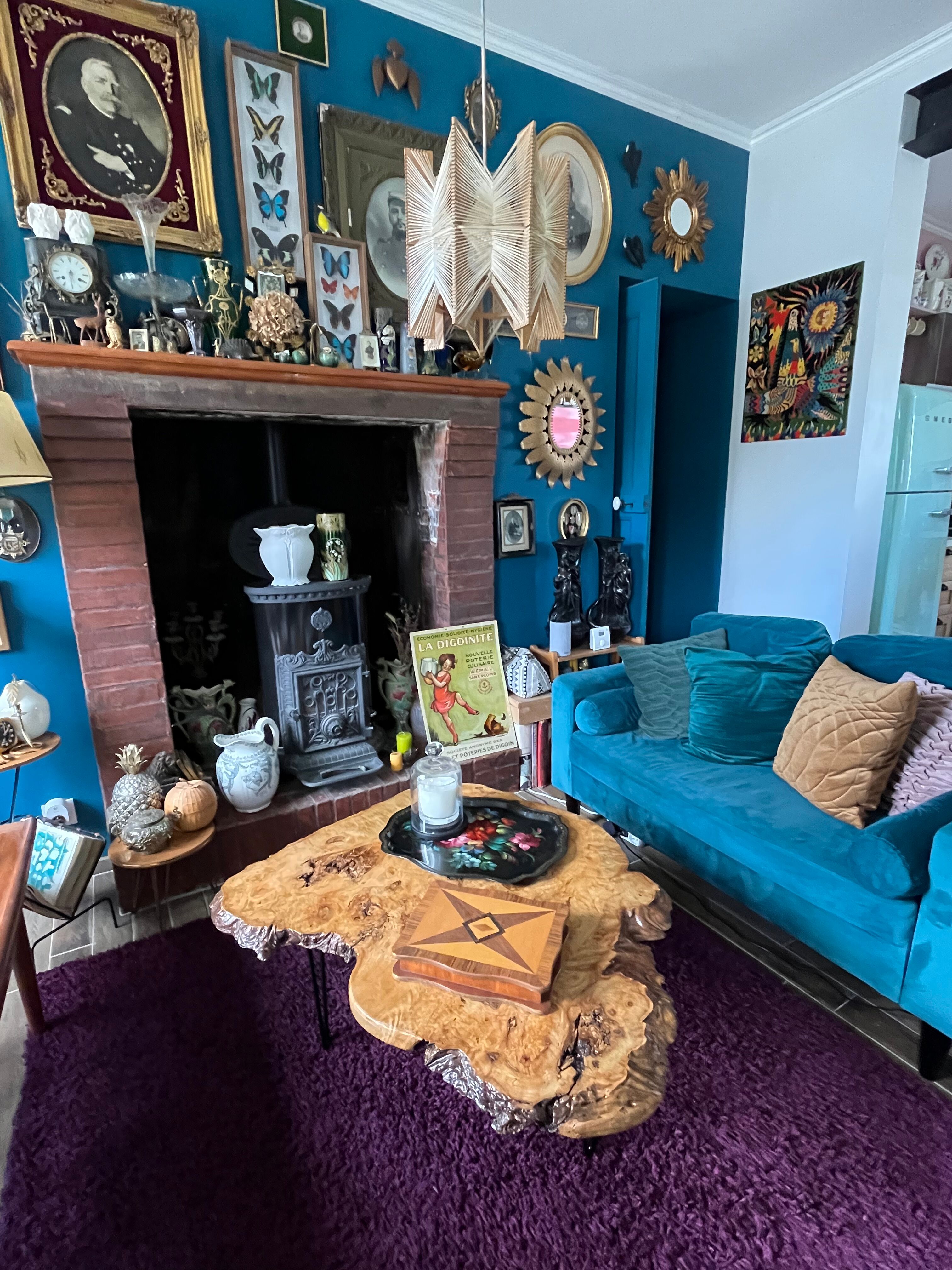 Tripod coffee table in natural solid elm magnifying glass