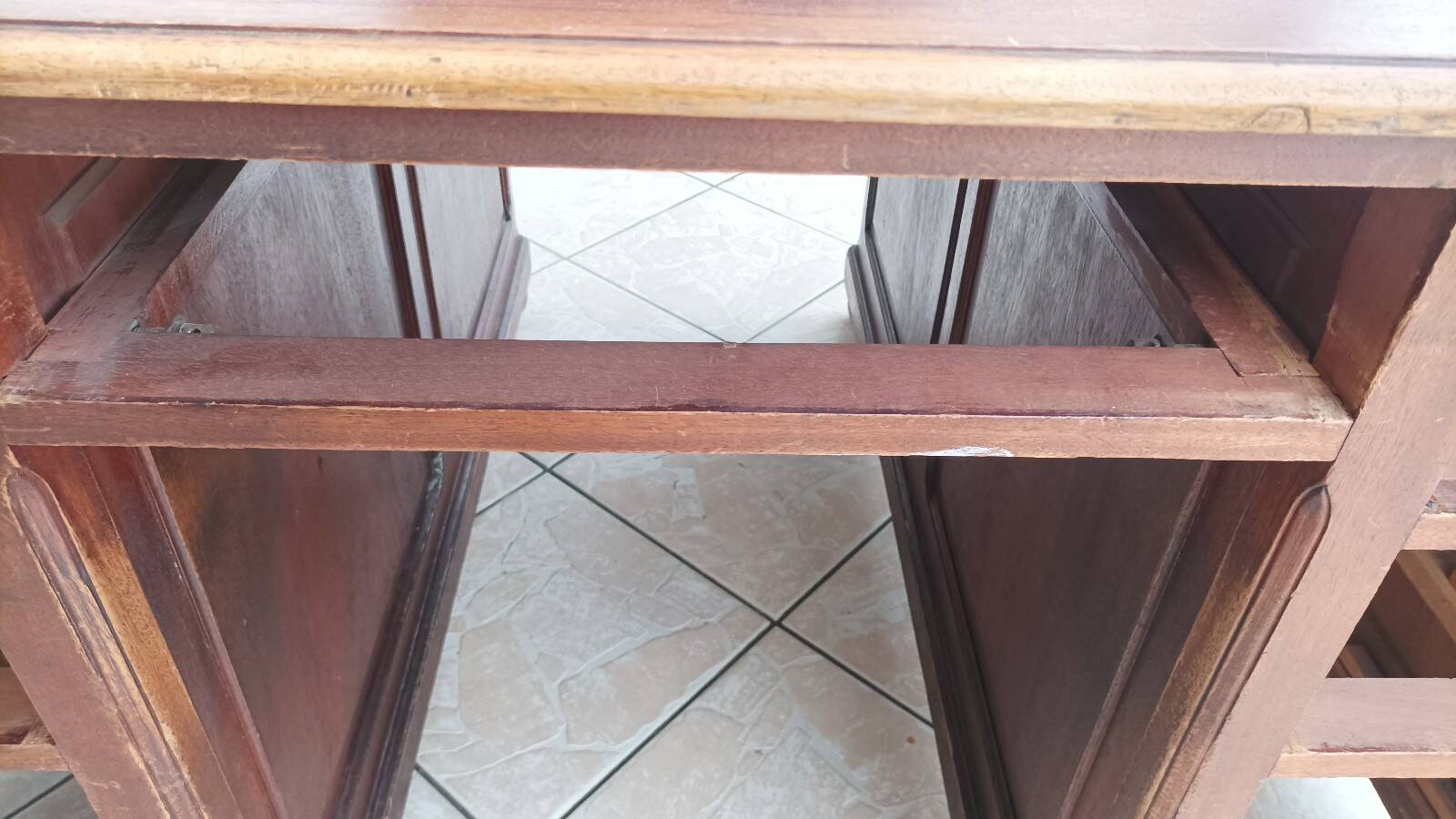 Vintage double-sided mahogany desk with 18 drawers.
