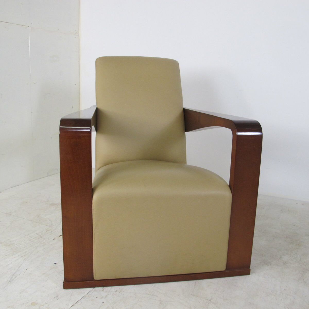 Leather armchair and art deco wood with Oottoman by Hugues Chevalier 2000s