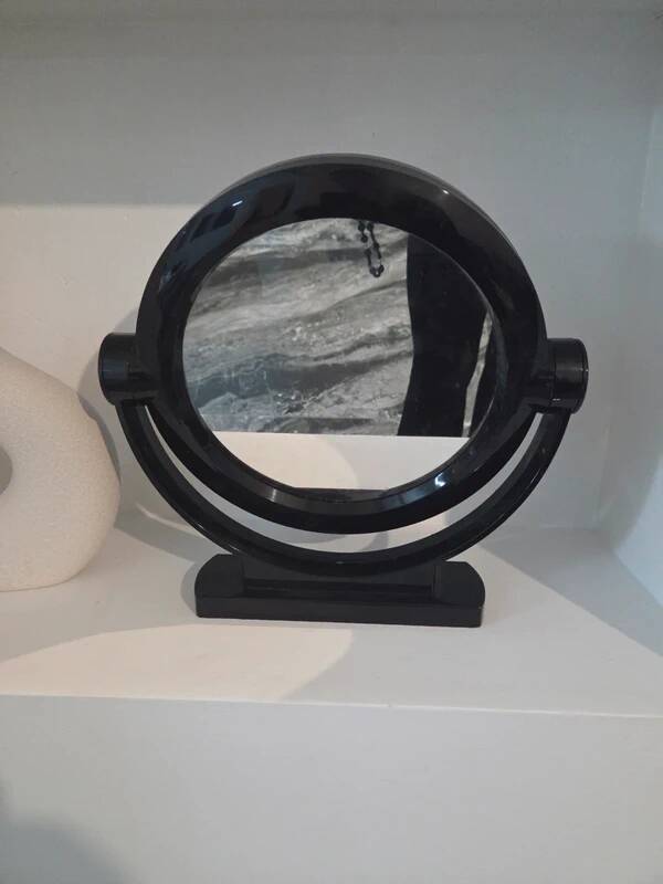 Vintage round pivoting mirror in black, retro style from the 70s/80s.