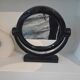 Vintage round pivoting mirror in black, retro style from the 70s/80s.