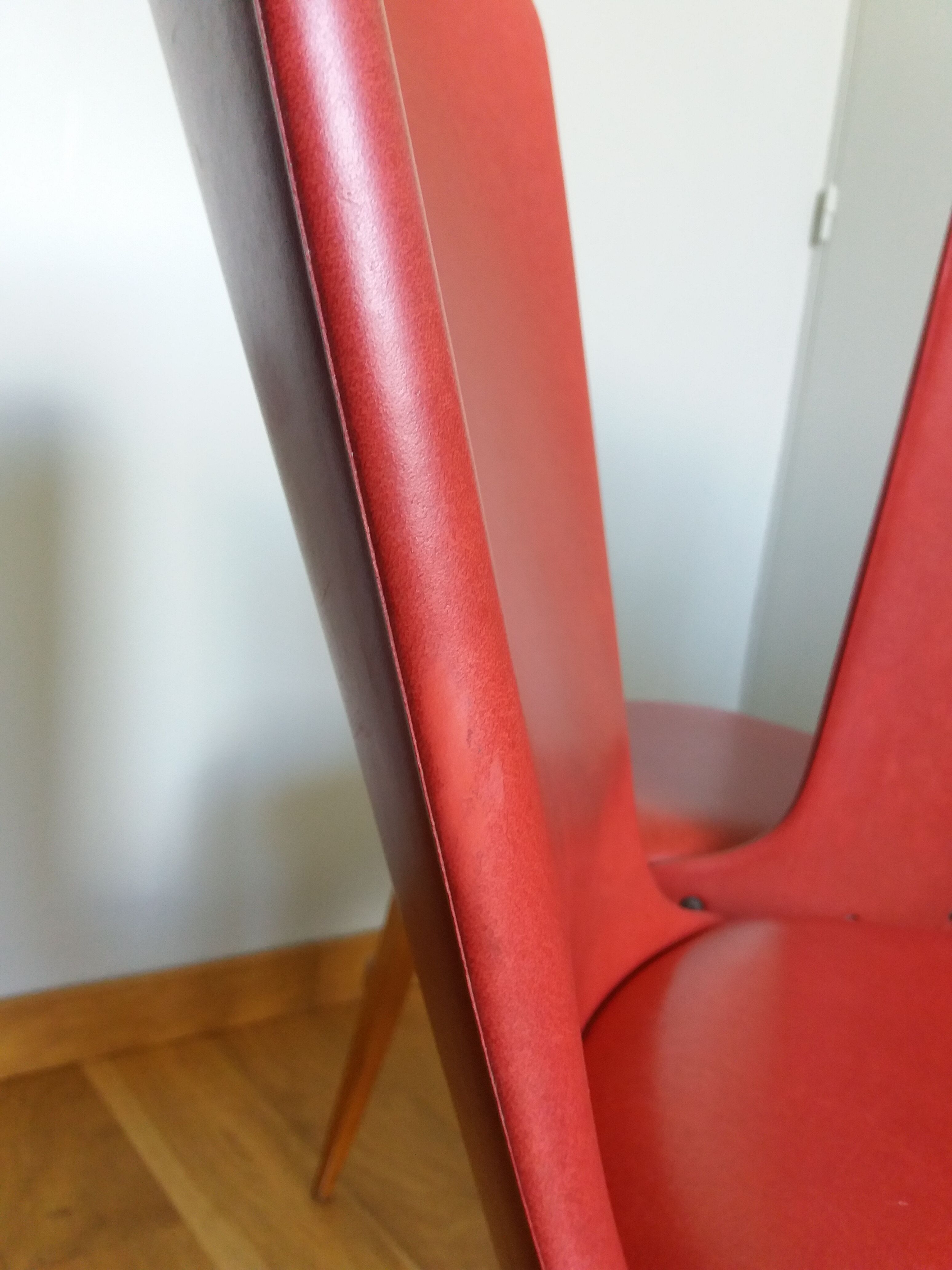 Baumann skai red imitation leather chairs from the 1950s