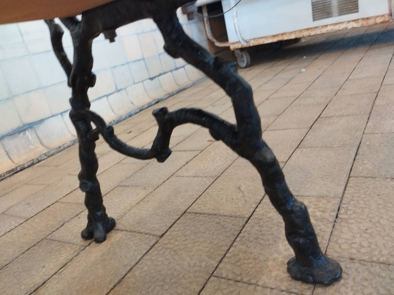 Antique garden bench with cast iron legs
