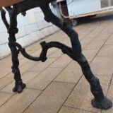 Antique garden bench with cast iron legs