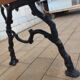 Antique garden bench with cast iron legs