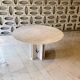 Round travertine dining table by Claude Berraldacci