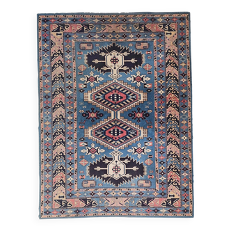 Vintage Kazak rug with geometric oriental motifs, 100% wool.
