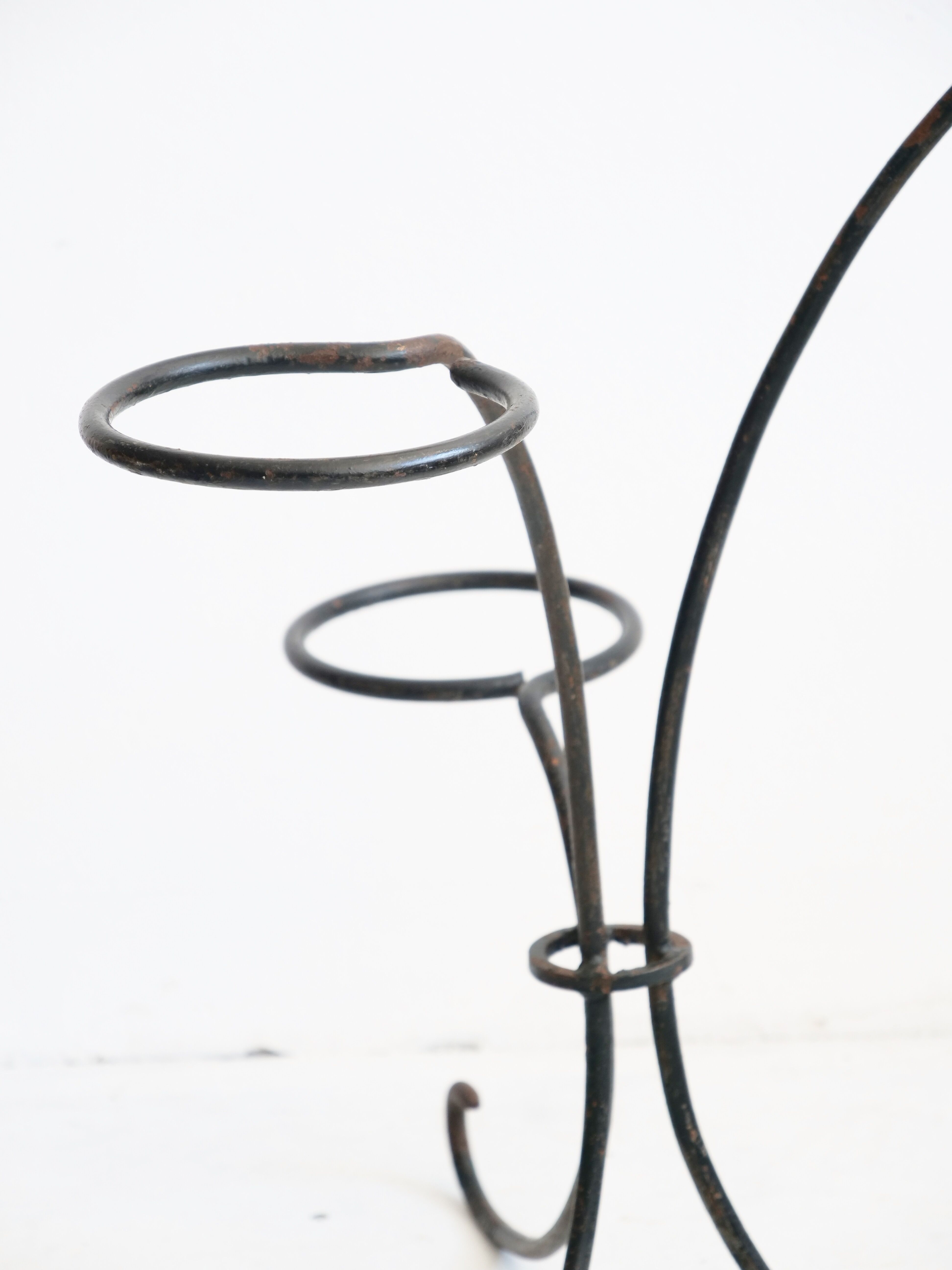 Arched steel flowered foot for balconies and terraces
