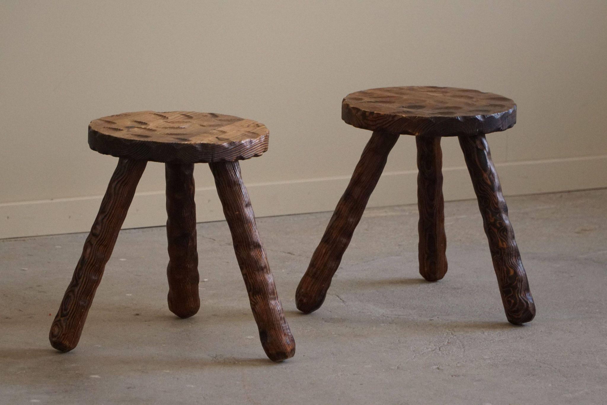 A pair of Wabi Sabi stools carved from pine, mid-century modern Swedish style, 1960s.