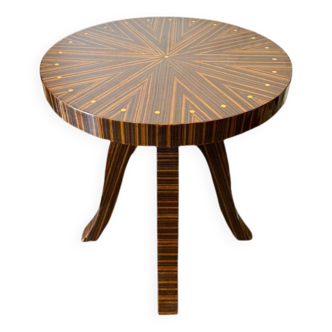 A round Art Deco table in rosewood and beech wood with elegant patterns