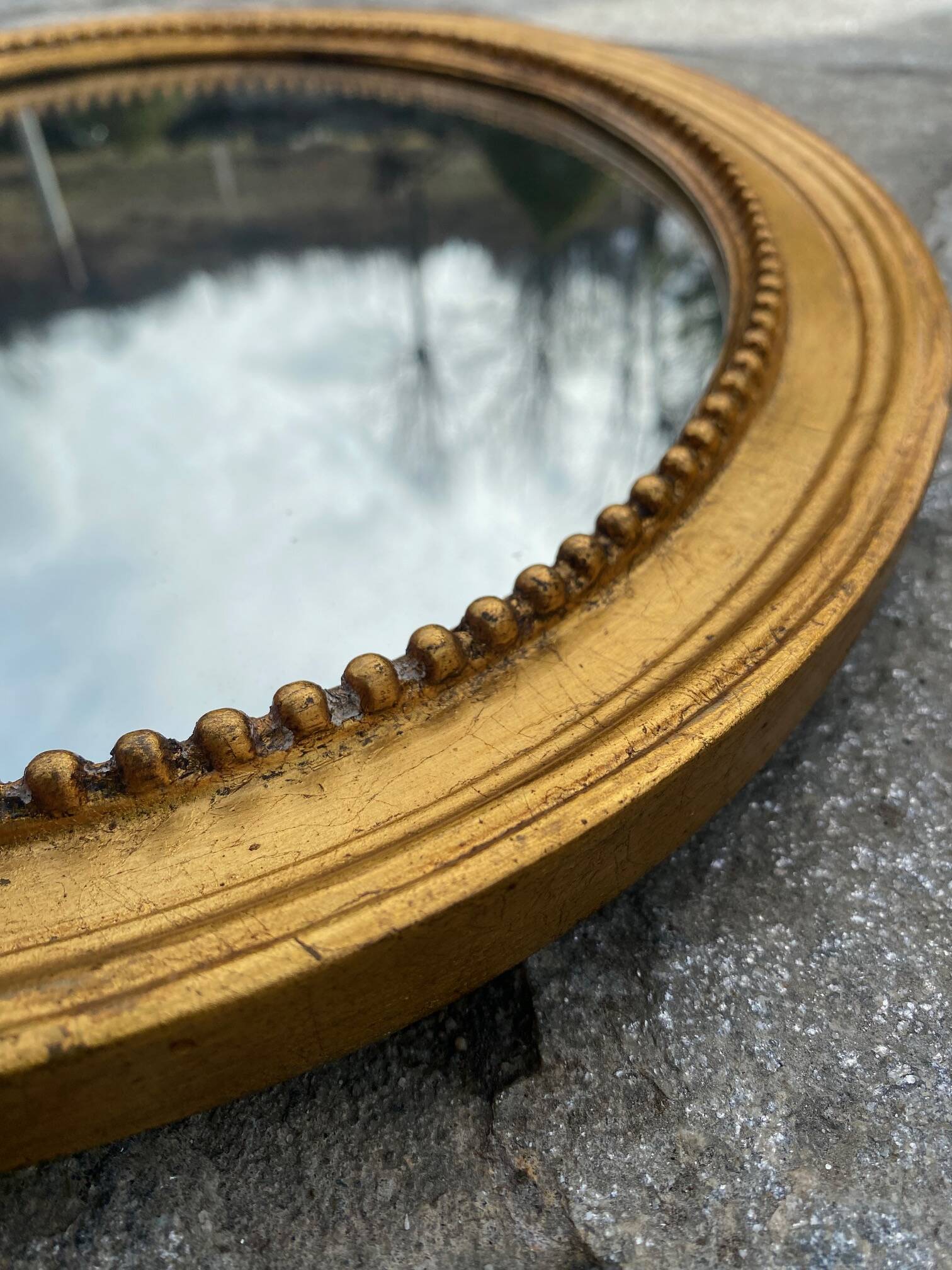 Antique gold oval mirror