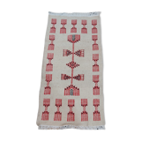 Traditional handmade white and red carpet