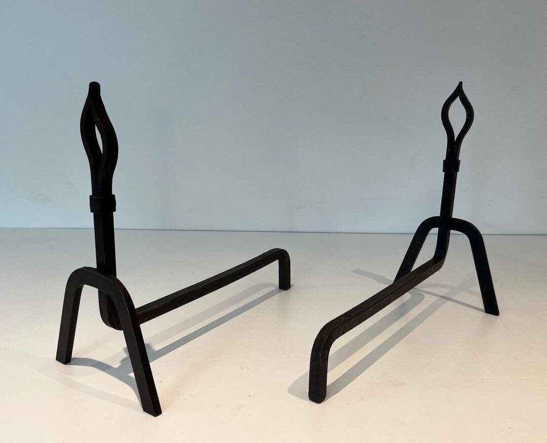 Pair of Modernist Andirons in Wrought Iron with Stylised Torches and Bases Ang