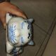 Vintage white and blue porcelain lying cat