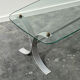 Design coffee table in brushed metal with a glass top, 1970s.