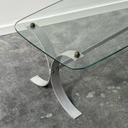 Design coffee table in brushed metal with a glass top, 1970s.