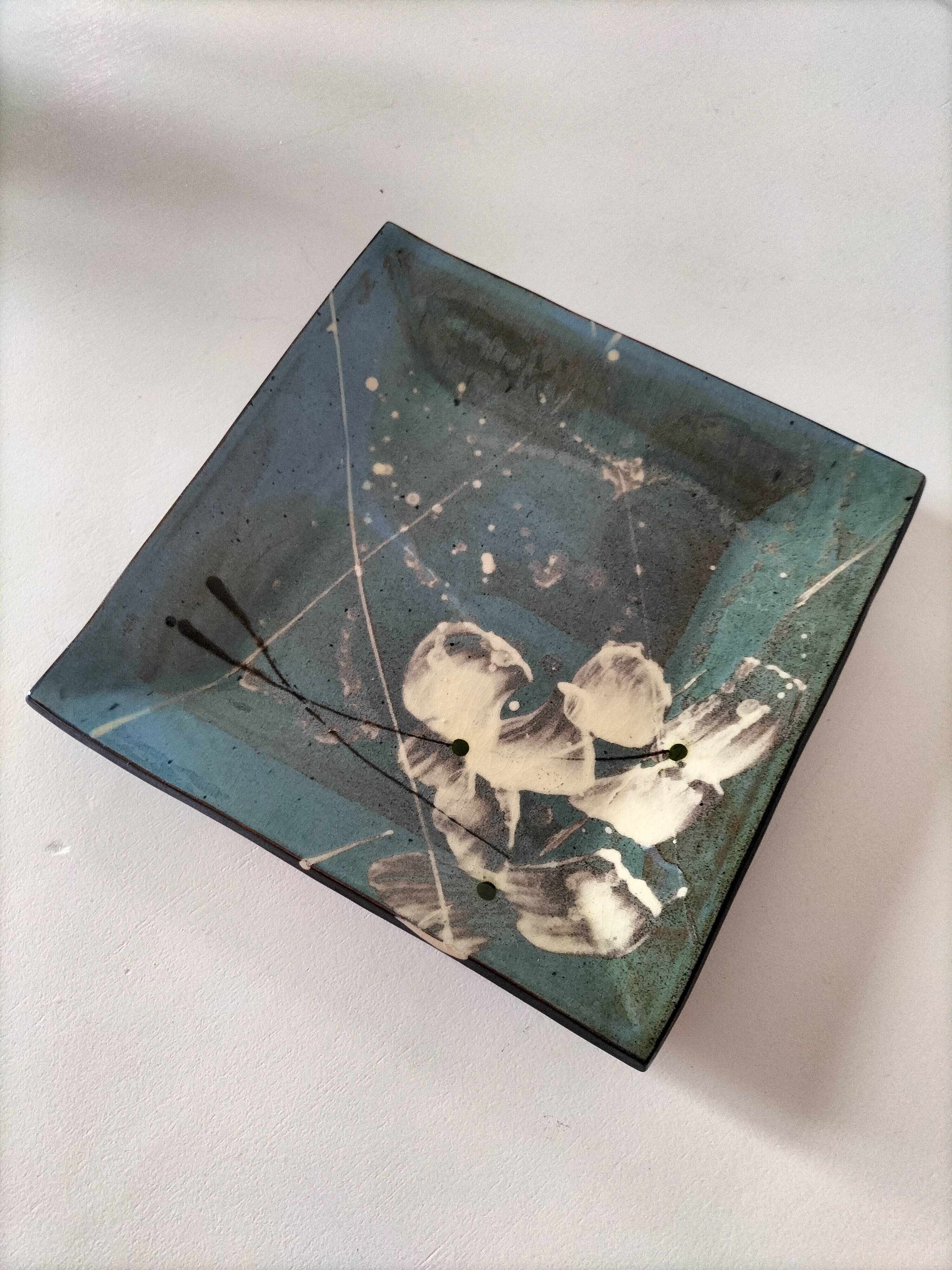 Square turquoise glazed stoneware dish, abstract floral decoration, signed.
