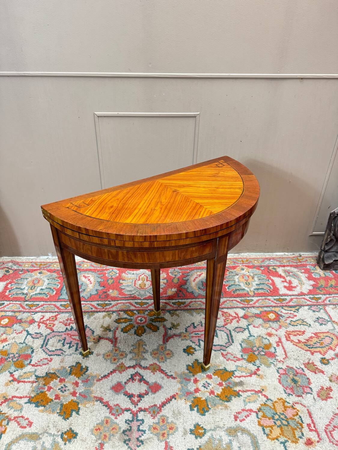 Half-moon game table in marquetry from the Louis XVI period, 18th century.