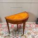 Half-moon game table in marquetry from the Louis XVI period, 18th century.
