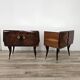 Mid-century mahogany bedside tables with mirrored tops.