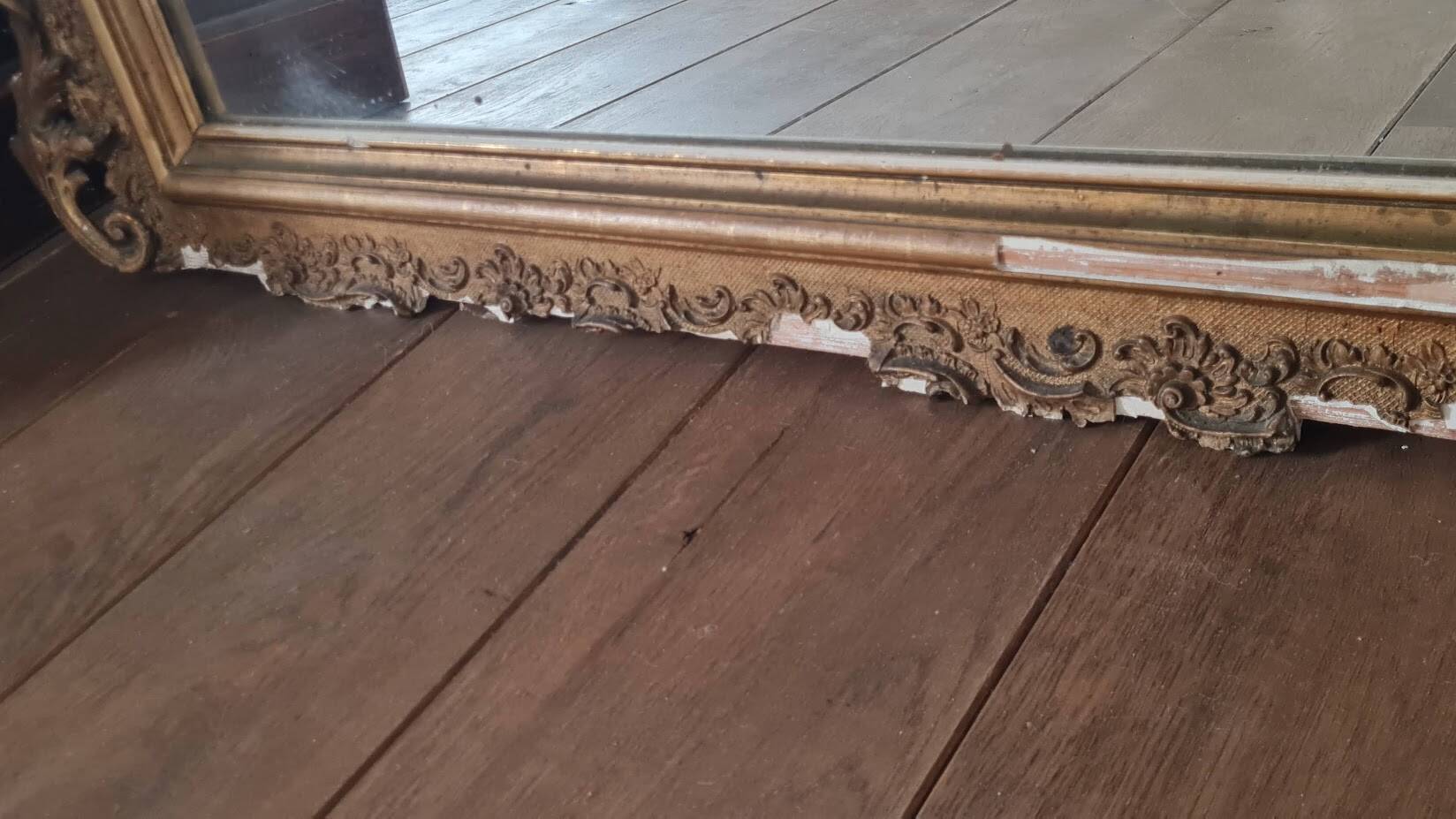 Antique Louis Philippe mirror with a pediment.