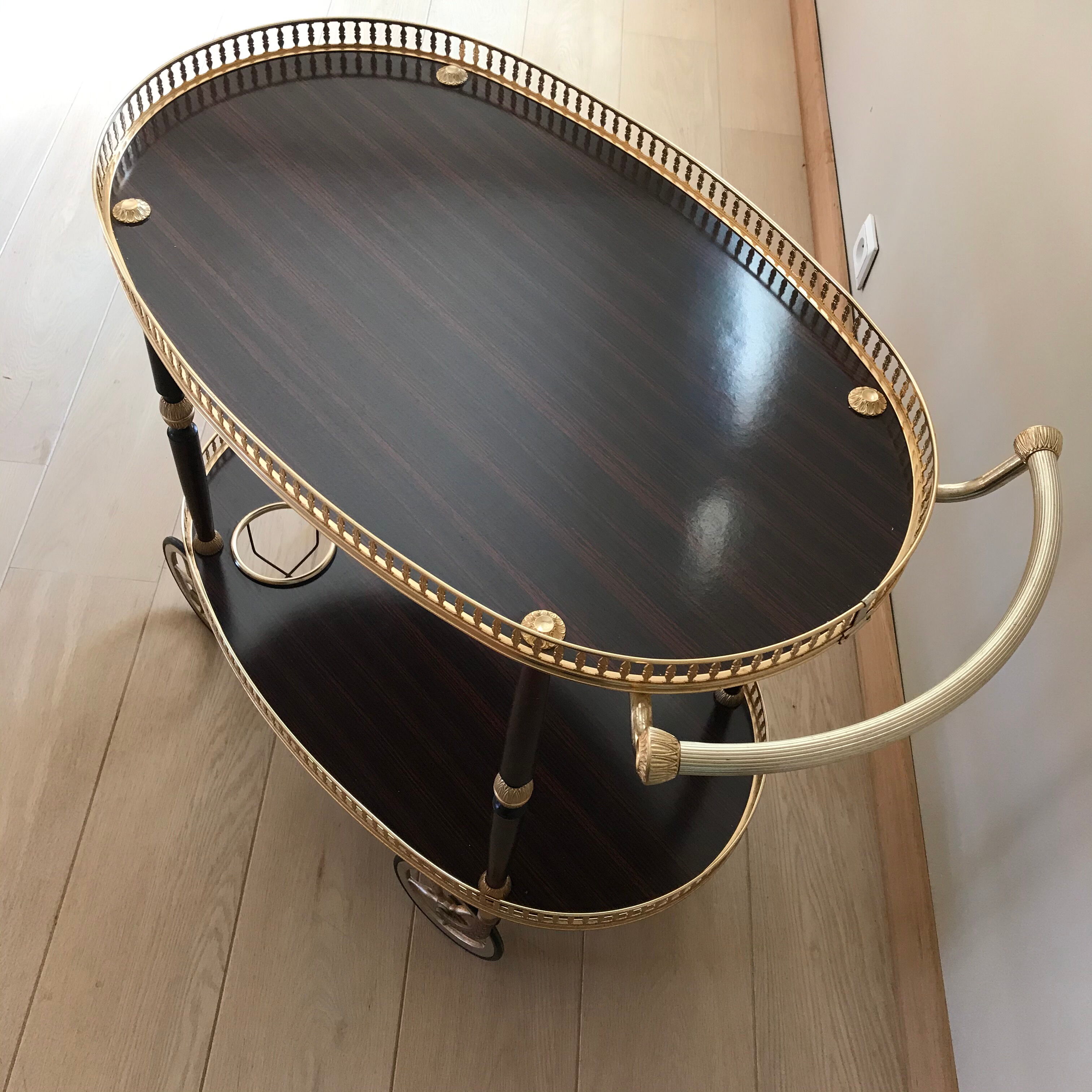 Golden wheeled serving trolley