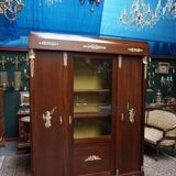 Empire style mahogany display bookcase with gilt bronze decoration and three doors.
