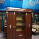 Empire style mahogany display bookcase with gilt bronze decoration and three doors.