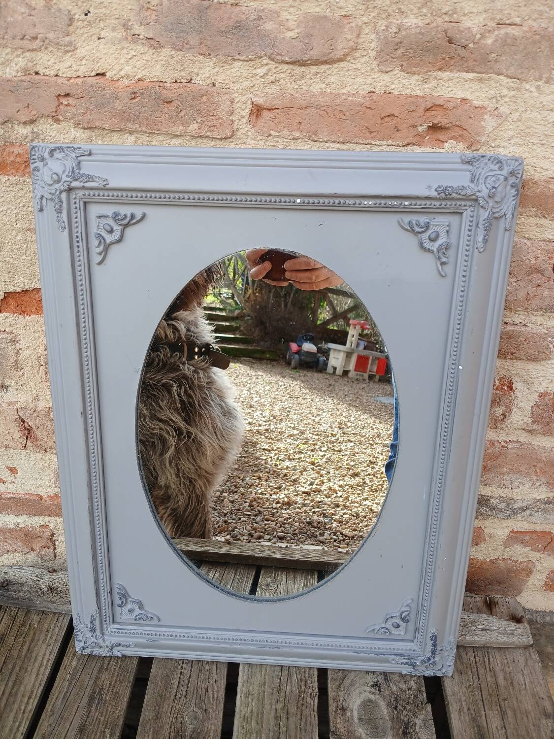 Mirror with a grey wooden frame