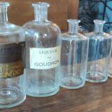 Series of 5 blown glass apothecary pharmacy bottles
