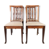 Set of four dining room chairs in rosewood and upholstered with light fabric, 1920s