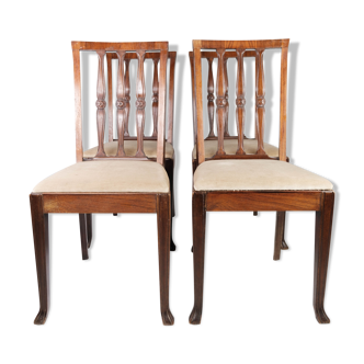 Set of four dining room chairs in rosewood and upholstered with light fabric, 1920s