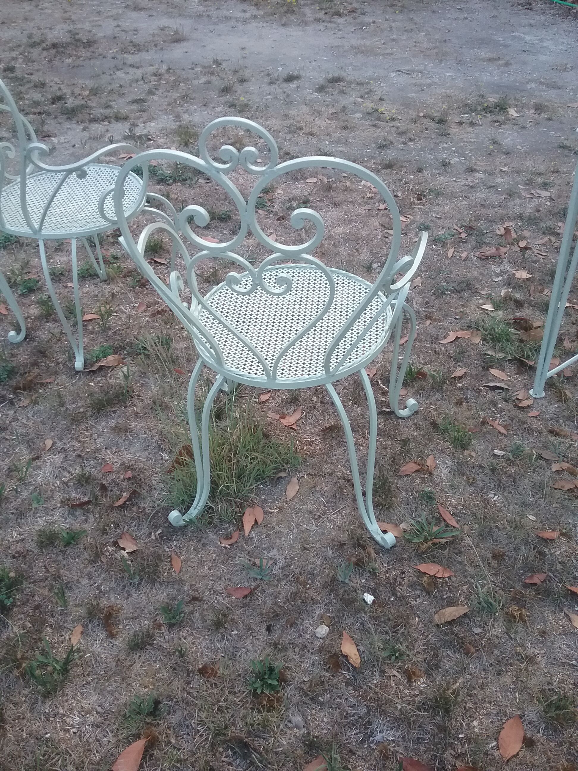 Garden furniture in green wrought iron