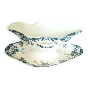 Antique sauce boat on a base in ironstone pottery.