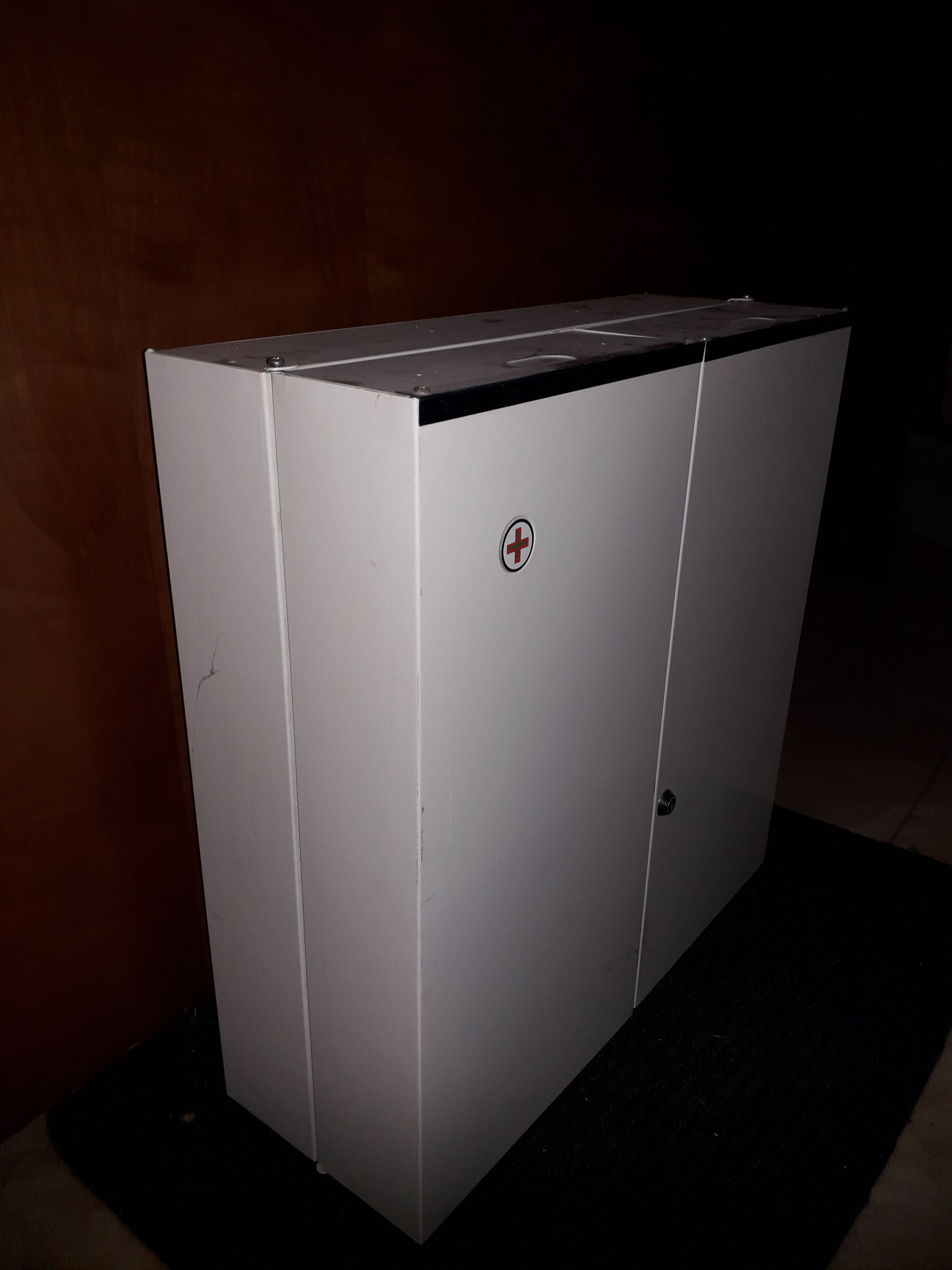 White lacquered metal medicine cabinet