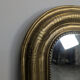 Golden wooden mirror with antique frieze from the Louis Philippe period.