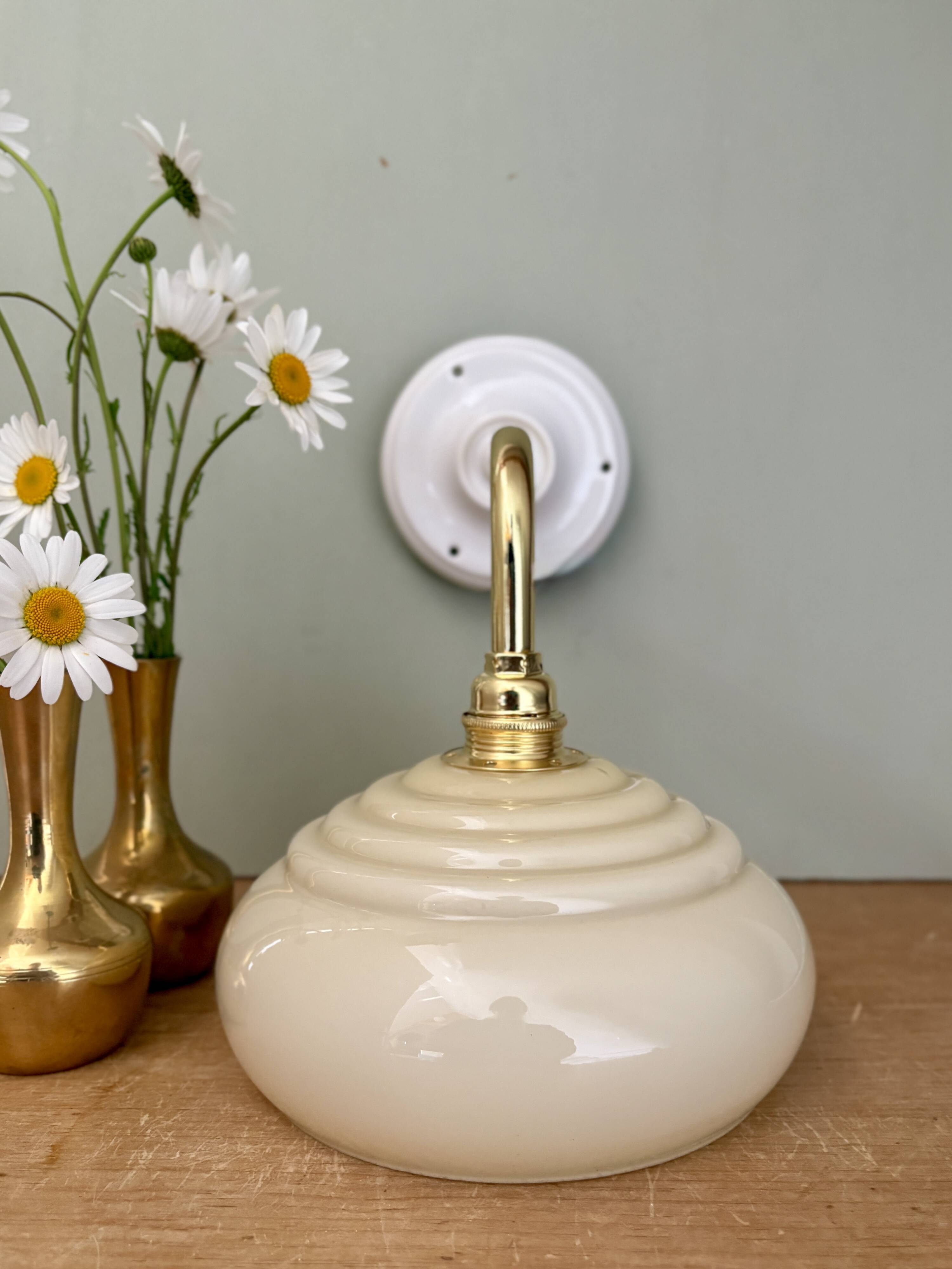 Vintage angled wall lamp with pale yellow opaline shade