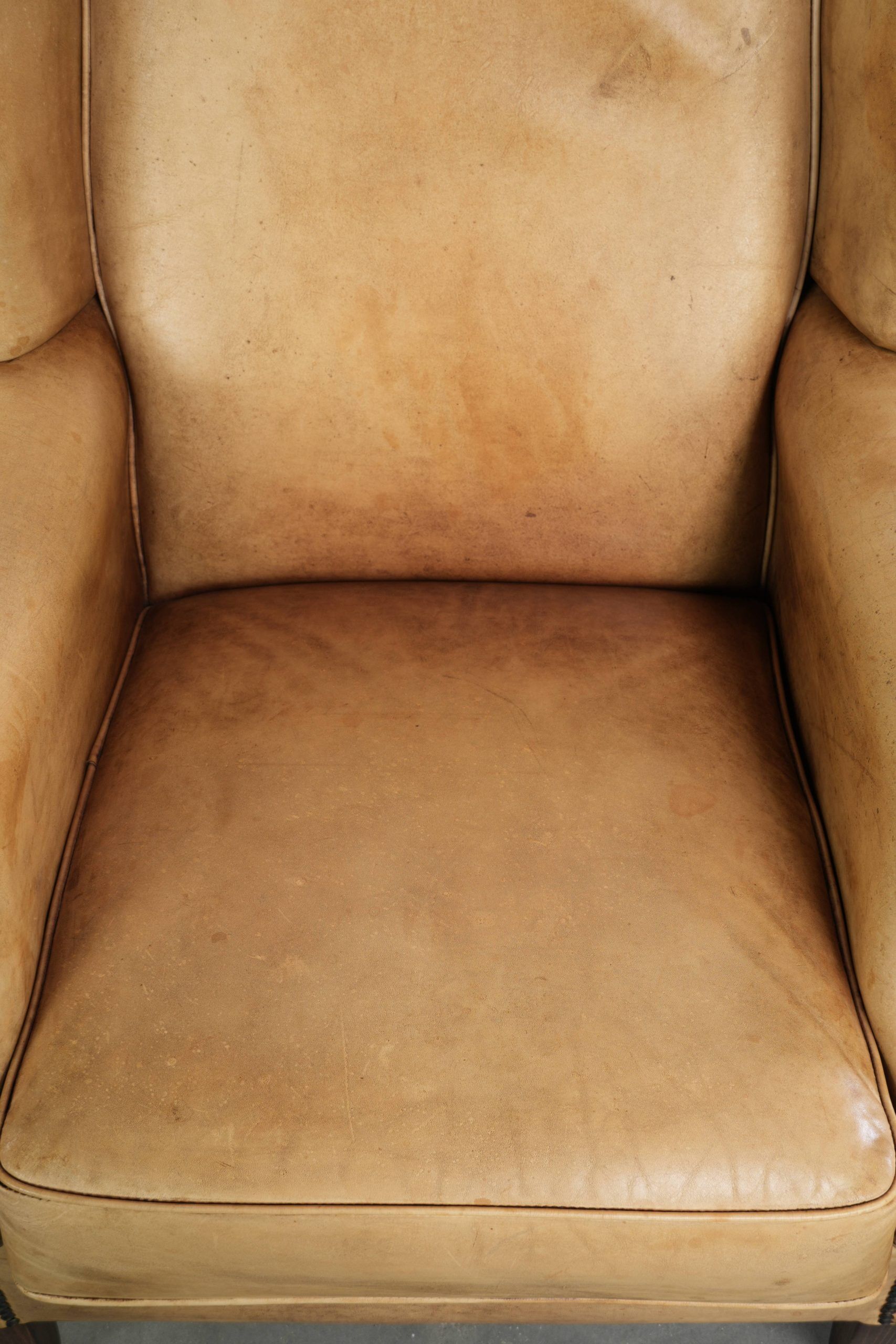 Cow leather wingback armchair with a beautiful timeless English look