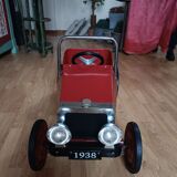 Vintage red pedal car