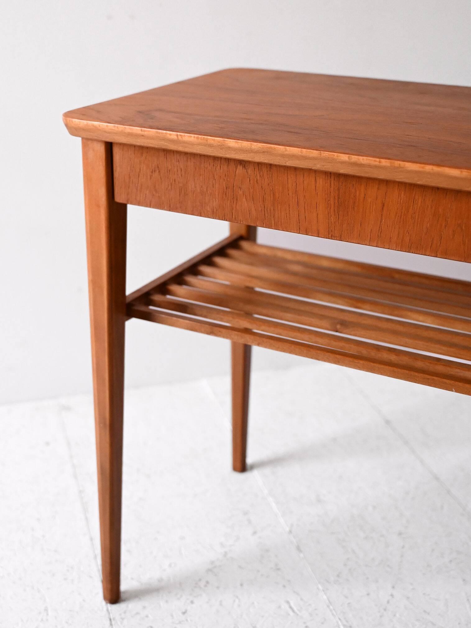 Scandinavian vintage teak nightstand with slatted shelf