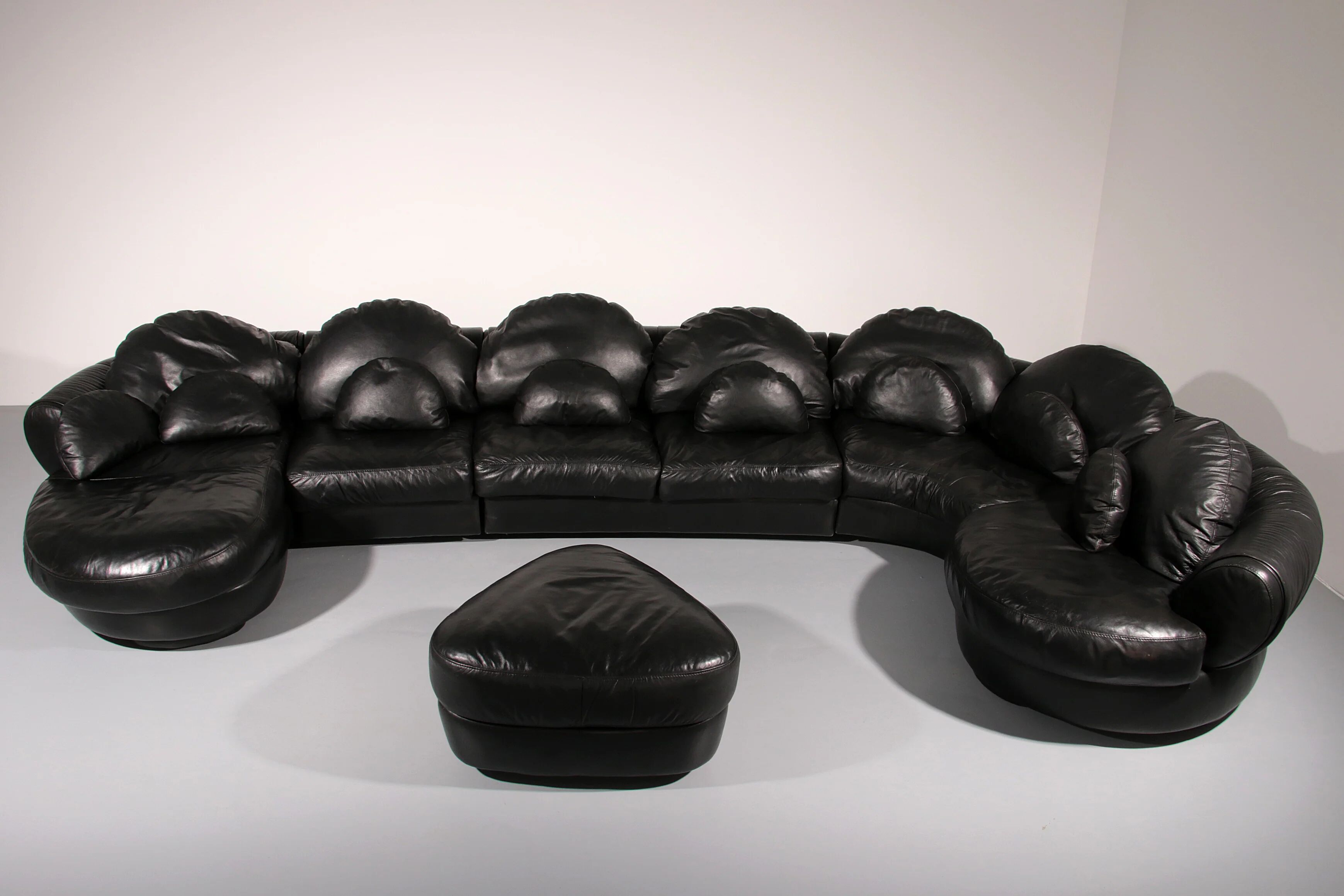 Organically shaped post-modern sectional sofa in black leather
