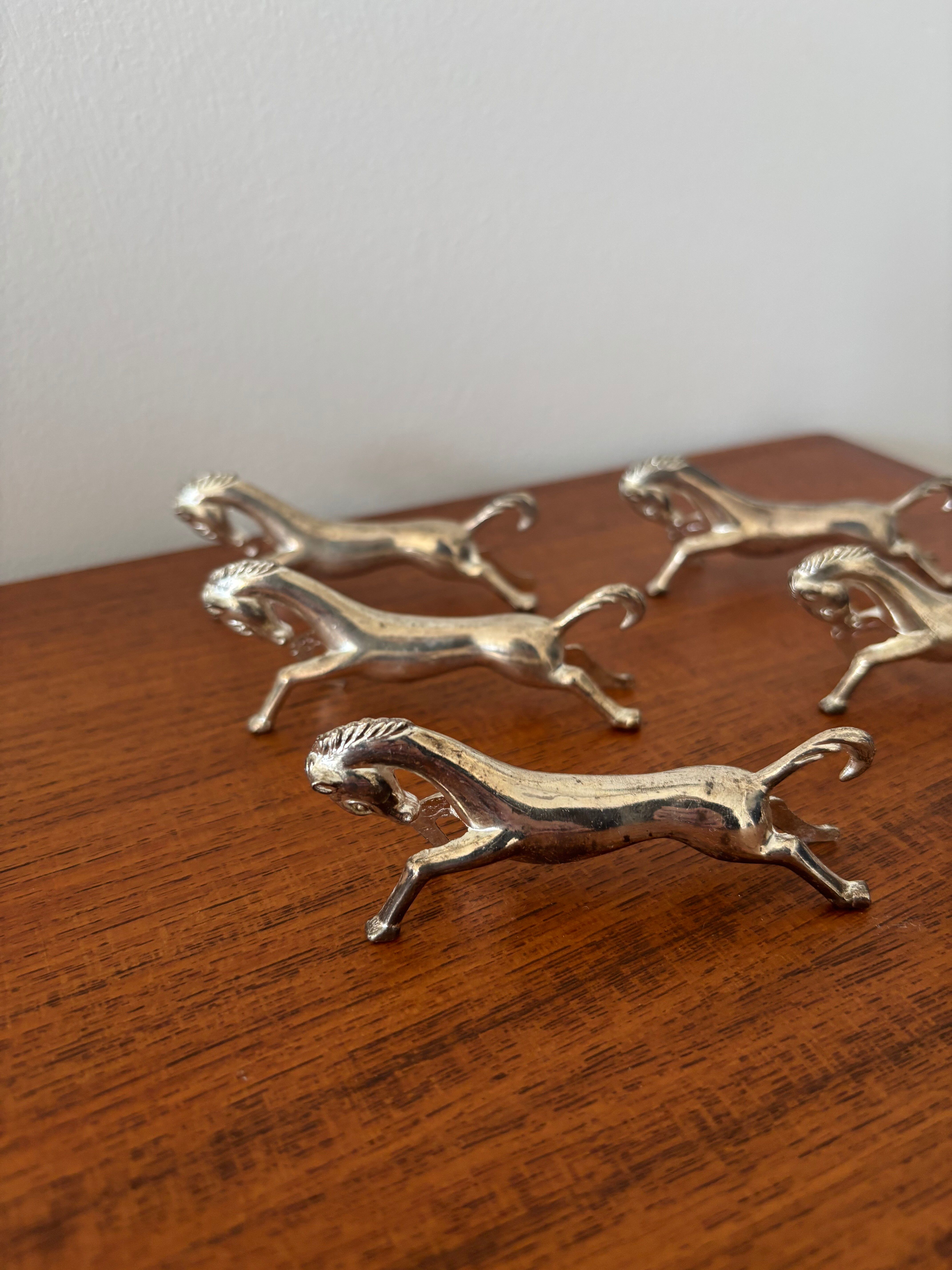 Set of 6 vintage galloping horse knife rests in silver-plated metal.